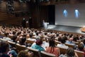 Business speaker giving a talk in conference hall. Royalty Free Stock Photo