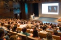 Business speaker giving a talk in conference hall. Royalty Free Stock Photo