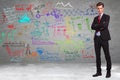 Business standing in front of a wall full of calculations Royalty Free Stock Photo