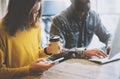 Business Startup Concept.Coworkers Teamworking Process.Bearded Hipster Typing Modern Desktop.Young Woman Using