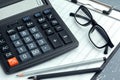 Business still life with calculator on table in office. creative photo. Royalty Free Stock Photo