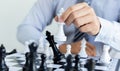 Business strategy, Businessman have the skills to play chess and be successful