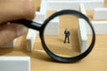 Business strategy conceptual photo - Miniature of businessman looking for solution on a labyrinth maze Royalty Free Stock Photo