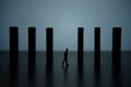 Business strategy conceptual photo Ã¢â¬â silhouette miniature of businessman walking in the middle of barrier wall