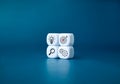 The action plan, business target icons on white dice cube blocks stack on blue background, minimal style. Royalty Free Stock Photo