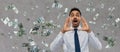 Indian businessman shouting over money rain