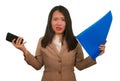 Business stress portrait of young attractive upset and stressed executive Asian Chinese woman tired and unhappy holding paperwork Royalty Free Stock Photo