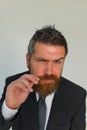 Business, style and confidence concept. Man with thick beard