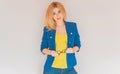 Business style, woman in blue jacket, yellow top Royalty Free Stock Photo