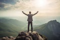 business success and achievement concept idea, businessman standing on the top of a mountain, inspirational image reaching goals Royalty Free Stock Photo