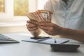 Business success - businessman counting cash money