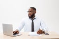 Business and success. Handsome successful African American man wearing formal suit, using laptop computer for distant Royalty Free Stock Photo