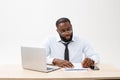 Business and success. Handsome successful African American man wearing formal suit, using laptop computer for distant