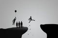 Abstract image of Silhouette people trying jump cross over the cliff, one man flying with balloon over cliff.