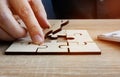 Business success and problem solving. Man holds piece of puzzle Royalty Free Stock Photo