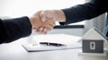 Business success, Real estate agents and customers shake hands to congratulate after signing a contract to buy a house