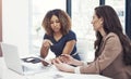 Business success is what theyre best at. two businesswomen using a digital tablet together during a collaboration at