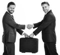 Business succsses. Business not brouken. Successful deal concept. Handover of suitcase in hands of partne Royalty Free Stock Photo