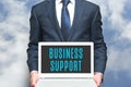 Business support advisor offers online help to businesss. Consultant worker in business suit Royalty Free Stock Photo