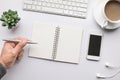 Business table top with mock up office supplies and male hand on white background.Flat lay design.