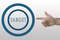 Business target concept. Human`s hand showing gun gesture and target inscription in circled aim. Royalty Free Stock Photo