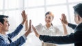 Business Team Achievement Success Mission Concept. Happy successful business team giving a high fives gesture as they Royalty Free Stock Photo