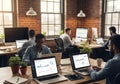 Business Team Analyzing Data on Laptops and Desktops, Modern Office Royalty Free Stock Photo