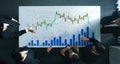 Business team analyzing financial graphs and charts on table with market trends and data, close-up view of hands and Royalty Free Stock Photo