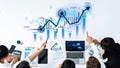 Business team analyzing financial growth data with charts, graphs, and laptop, emphasizing strategy and collaboration Royalty Free Stock Photo