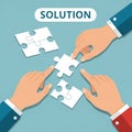 Business team assembling puzzle pieces to represent problem-solving and collaboration Royalty Free Stock Photo