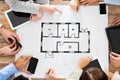 Business team with blueprint and gadgets Royalty Free Stock Photo