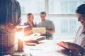 Business team brainstorming. Marketing plan researching. Paperwork on the table, laptop and mobile phone Royalty Free Stock Photo