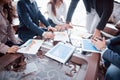 Business team brainstorming. Marketing plan researching. Paperwork on the table, laptop and mobile phone Royalty Free Stock Photo