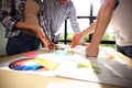 Business team brainstorming. Marketing plan researching. Paperwork on the table, laptop and mobilephone Royalty Free Stock Photo