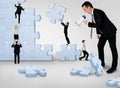 Business team building puzzle Royalty Free Stock Photo