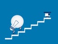 Business team carrying light bulb idea on stairs to target and success point. Stairs step to success. Royalty Free Stock Photo