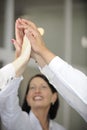 Business team celebrating success with high five Royalty Free Stock Photo