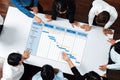 Business team collaborating on project management timeline with Gantt chart on table showcasing phases, tasks, and Royalty Free Stock Photo