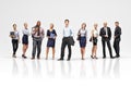 Business team concept. Group of diverse adult business professionals standing casually in a studio setting. Royalty Free Stock Photo