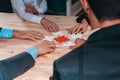 Business team connect pieces of puzzle like a teamwork and partners Royalty Free Stock Photo