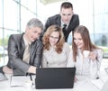 Business team discussing business issues sitting behind a Desk Royalty Free Stock Photo