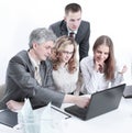 Business team discussing business issues sitting behind a Desk Royalty Free Stock Photo