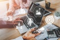 Business team discussing data with document data with VR screen quality management icon on desk table Royalty Free Stock Photo