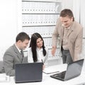 Business team discussing business issues,sitting behind a Desk Royalty Free Stock Photo