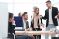Business team discussing work issues near the desktop . Royalty Free Stock Photo
