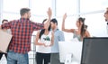 Business team is giving each other a high five in the new office Royalty Free Stock Photo