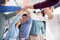 Business team giving highfive together on workplace in office Royalty Free Stock Photo