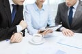 Business team with graph, tablet pc and coffee Royalty Free Stock Photo