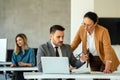 Business team having a meeting in office and solving problem. Teamwork, people and crisis concept. Royalty Free Stock Photo