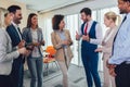 Business team having a meeting standing in the office. Royalty Free Stock Photo